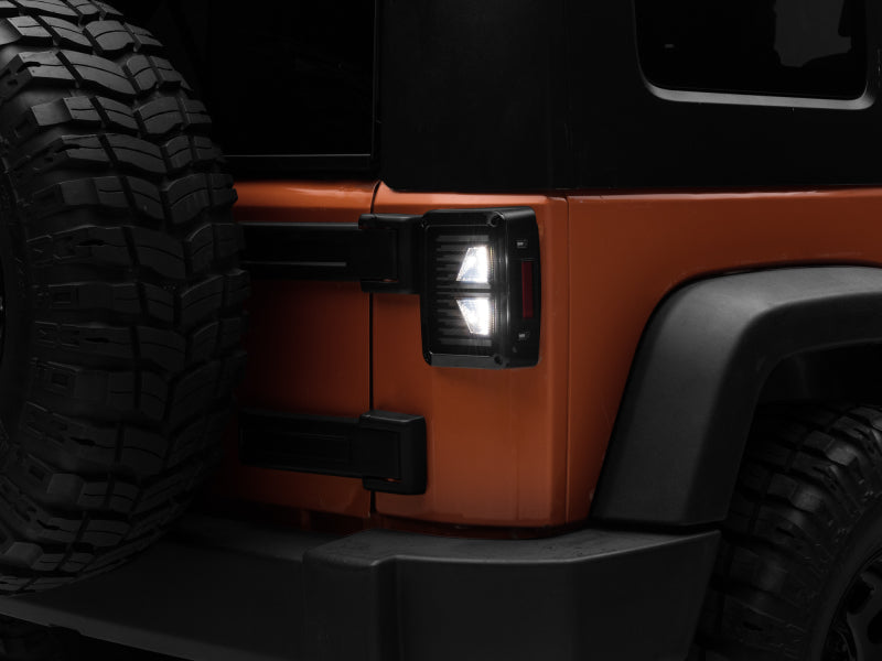 Raxiom Tail Lights Raxiom 07-18 Jeep Wrangler JK Axial Series Vision LED Tail Lights- Black Housing (Smoked Lens)