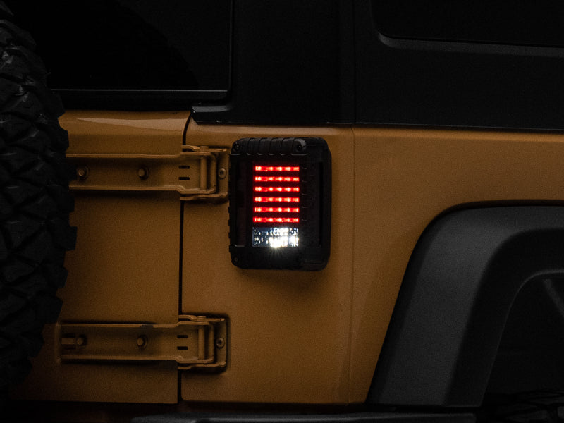 Raxiom Tail Lights Raxiom 07-18 Jeep Wrangler JK LED Tail Lights- Black Housing (Smoked Lens)